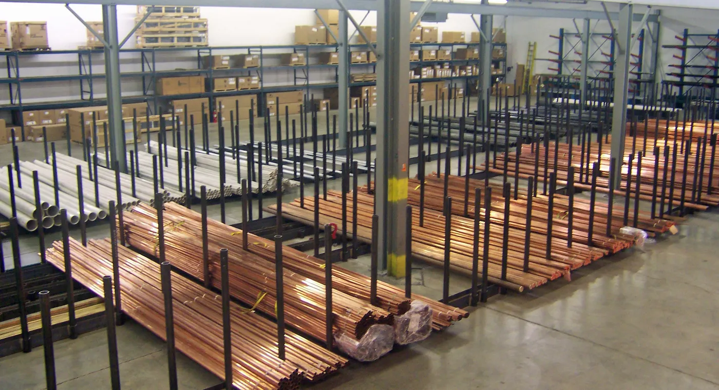 Copper and steel pipe racks in an ILLCO warehouse